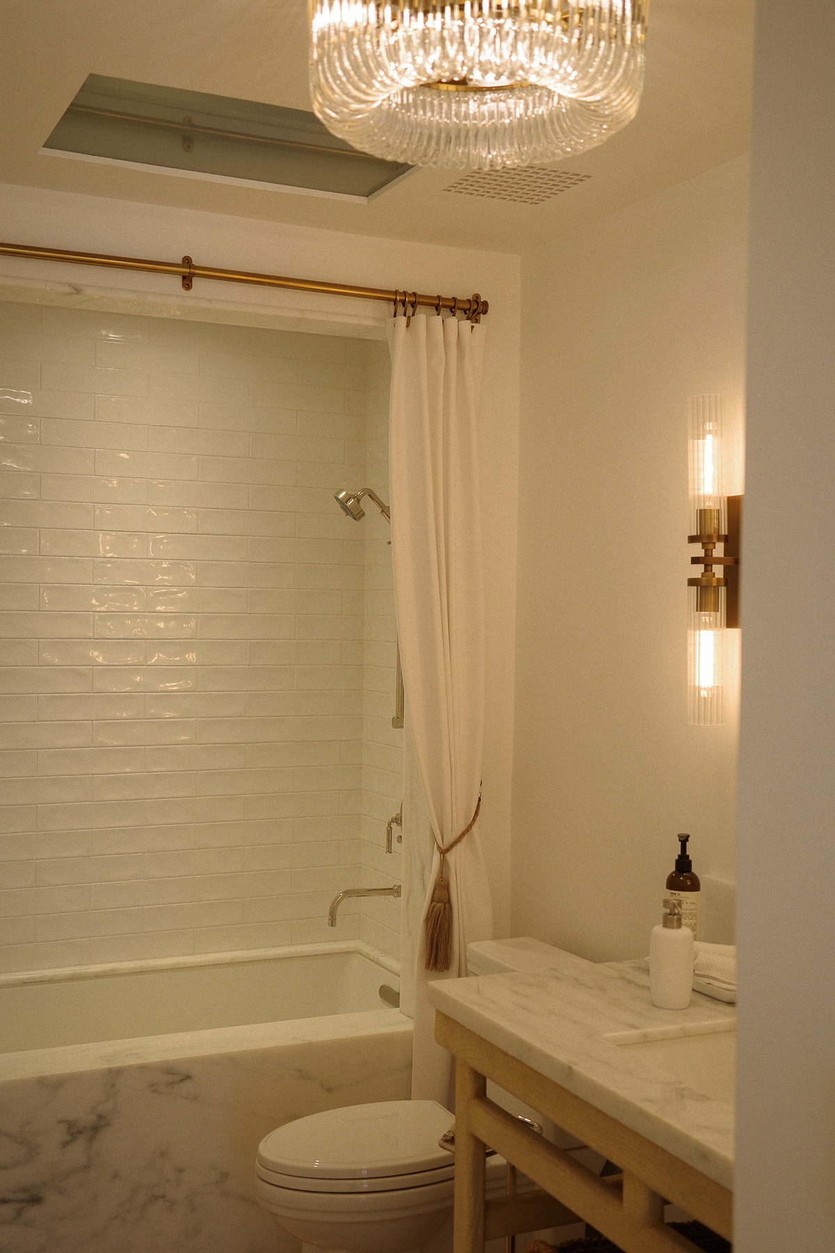 Bathtub and chandelier