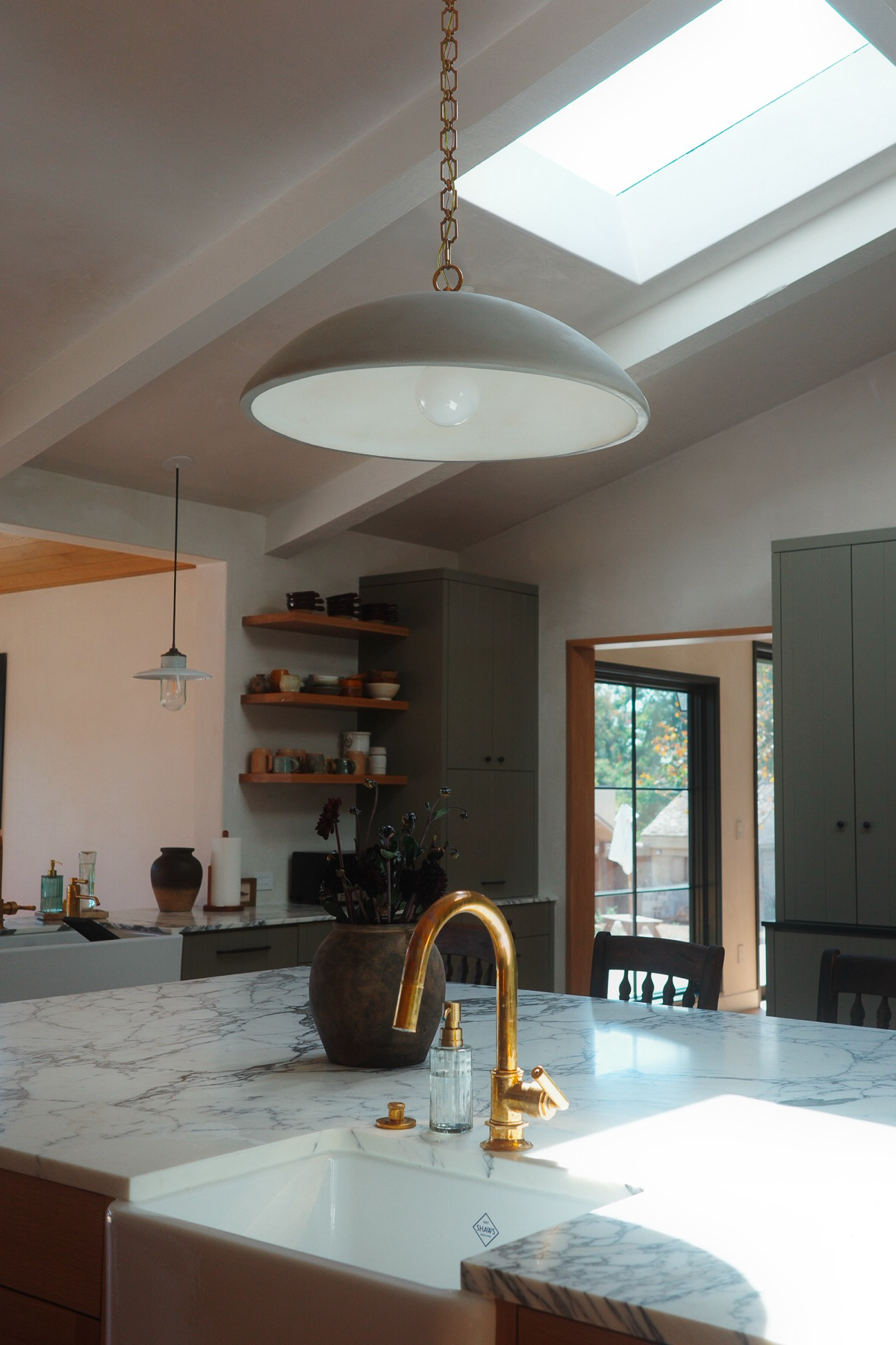 Kitchen island and brass faucet at Hope Ranch