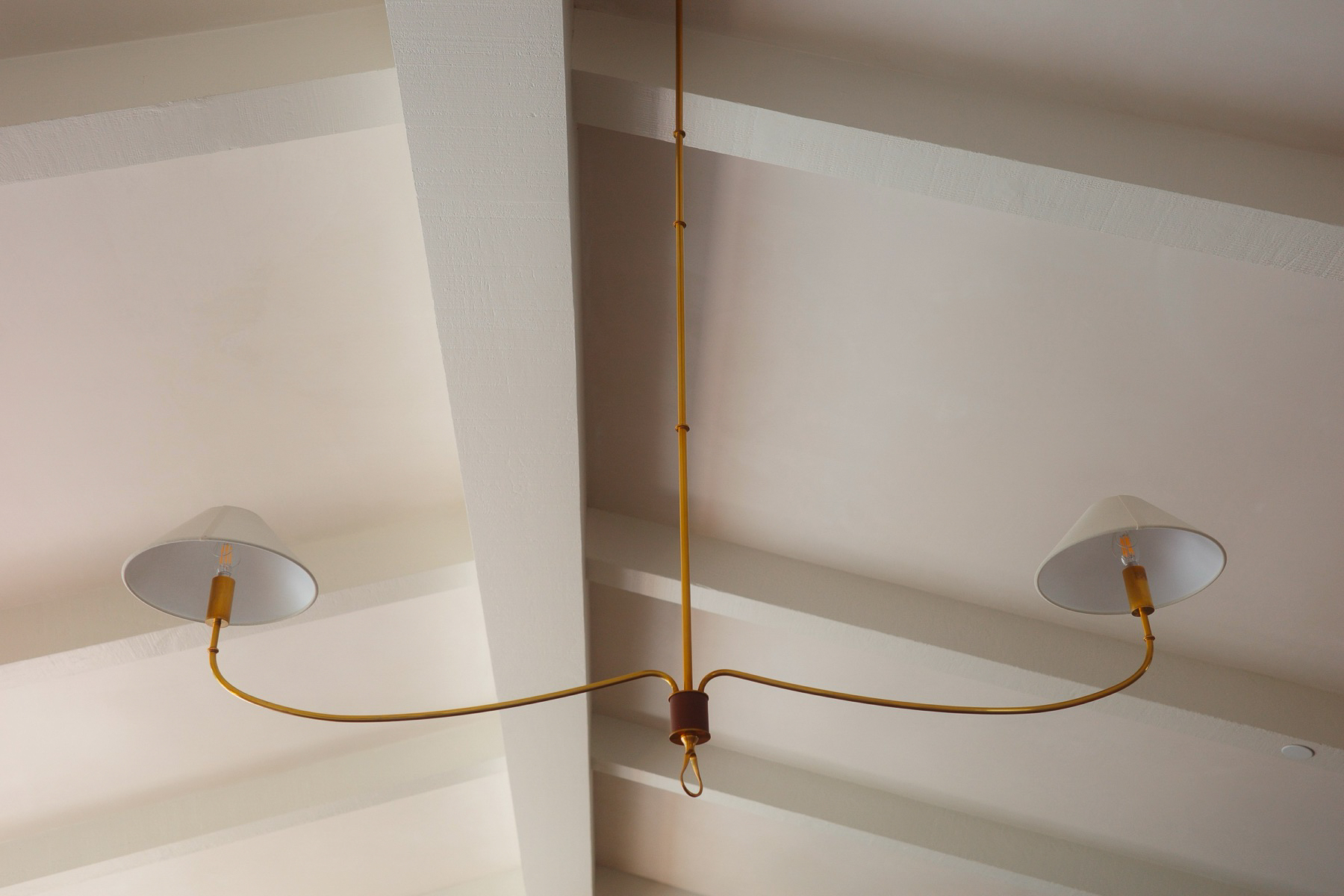 Brass chandelier beneath the Hope Ranch ceiling