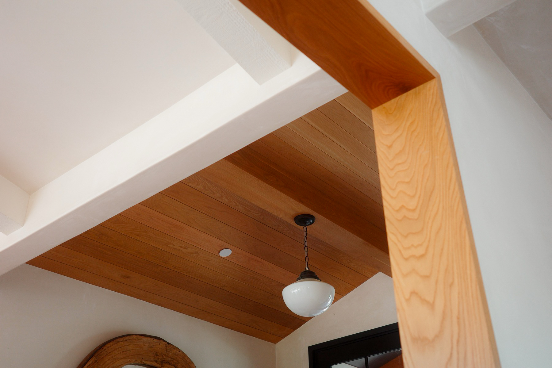 Wood-clad entry ceiling and pendant at Hope Ranch