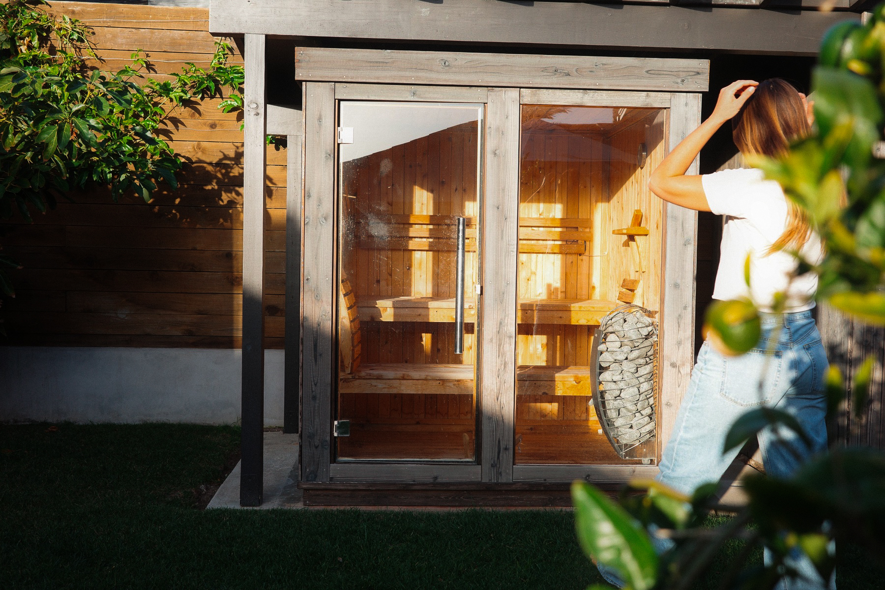 Cedar sauna doors at golden hour
